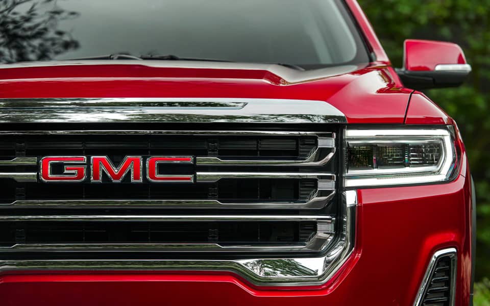 Front grille of a red Acadia